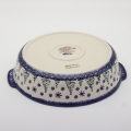 Round ceramic serving dish with handles – Bolesławiec pottery, hand-decorated with traditional patterns. Perfect for serving meats, salads, and appetizers. Stylish and durable Polish ceramic.
