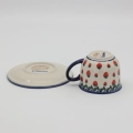 Hand-painted Bolesławiec cup and saucer decorated with a charming strawberry pattern. Traditional Polish pottery perfect for coffee, tea, and kitchen decor.